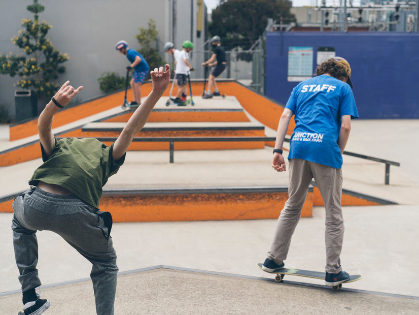 A content card image of a  Junction Skate and BMX Park staff member riding a skateboard